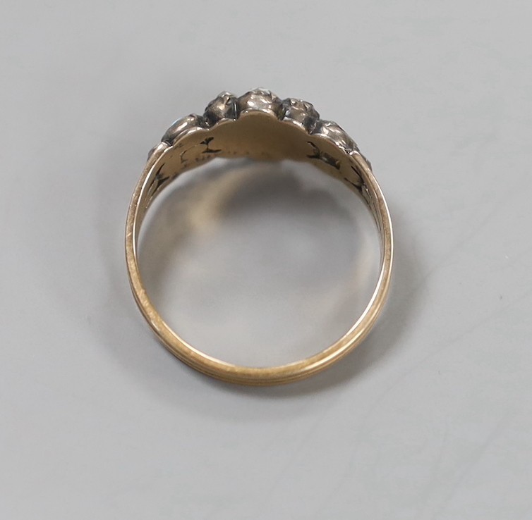 A Georgian yellow metal, diamond and turquoise set cluster ring, with turquoise and diamond set split shoulders (stoen missing), size P, gross weight 3.1 grams.